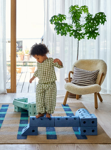 Young toddler playing on a MODU obstacle course. Product color: Deep Blue Sky Blue.